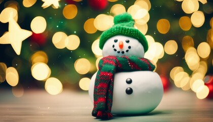 A snowman with a green hat and scarf sits on a table