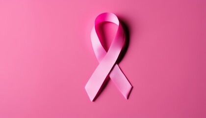 A pink ribbon on a pink background