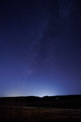 blue sky at sunset filled with stars near zion national park, utah