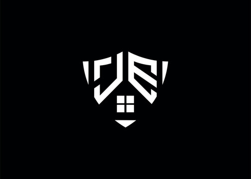 Real estate letter JE shield shape logo and house building vector template