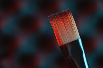 paintbrush on a dark background. painting arts theme.