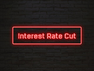Interest Rate Cut のネオン文字