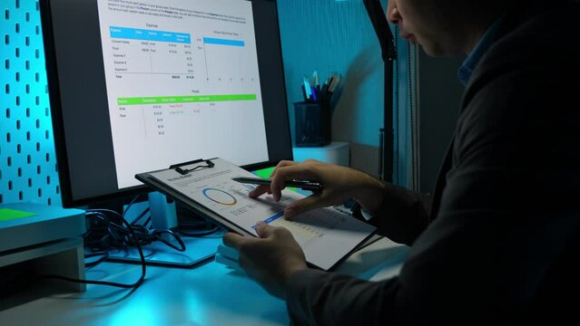 Asian male businessman sits and analyzes the situation in a financial report in his private office. use of thought business strategy analysis financial advisor concept.