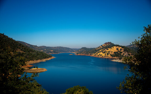 Lake Don Pedro and surrounding mountains with trees