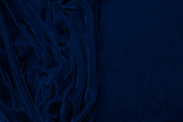 dark blue corduroy fabric texture used as background. Emerald color panne fabric background of soft...