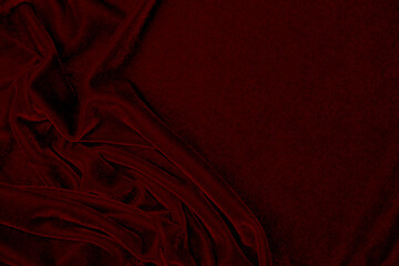 Red silk fabric velvet texture used as background. red panne fabric background of soft and smooth...