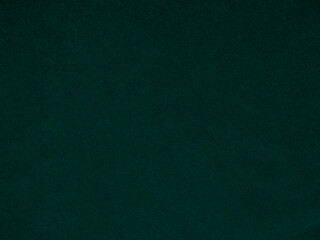 Dark green velvet fabric texture used as background. Emerald color panne fabric background of soft and smooth textile material. crushed velvet .luxury emerald tone for silk