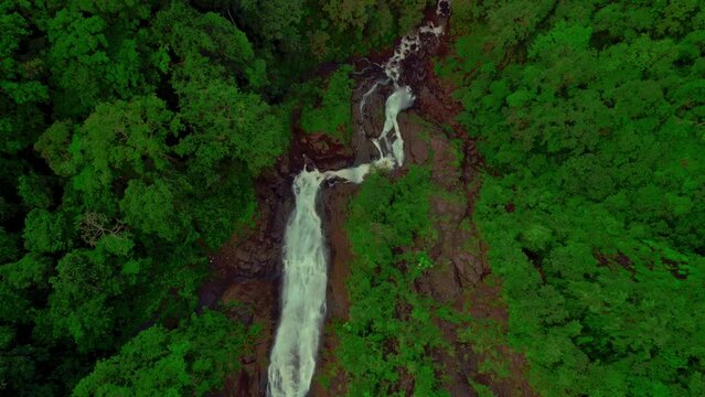 Aerial view of  majestic Bijagual Waterfall or Manantial de Agua Viva, the tallest waterfall in Costa Rica. Cascading masterpiece hidden within the heart of the country's rich biodiversity.