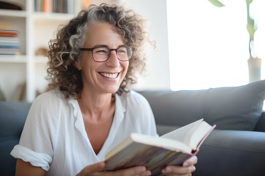 a middle-aged woman reading a book in a sunlit living room, smiling. generative AI
