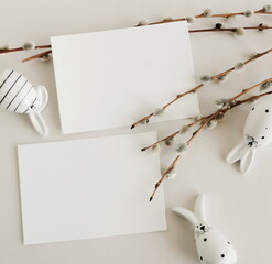 Easter background.Cards mockup, empty blank paper,Easter funny bunny decor ,spring willow branches ...