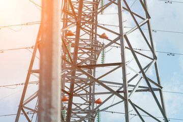 High voltage towers with sky background. Power line support with wires for electricity...