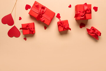 Many gift boxes and hearts on beige background. Valentine's Day celebration