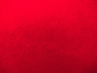 a close-up of a piece of red paper. The paper is smooth and has a slightly glossy finish. The image is well-composed, with vibrant colors and sharp focus.