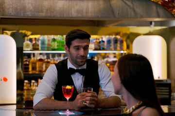 Bartender and customer at night club.