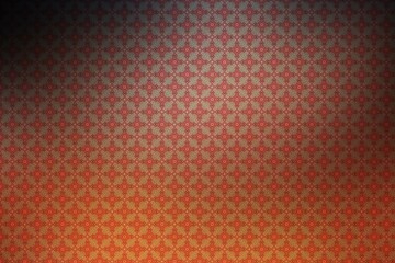 Abstract background with a pattern of red and orange flowers on a dark background