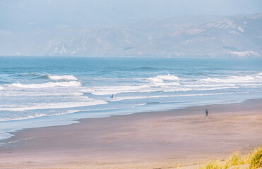 San Francisco, California, USA - October 21, 2021. People walk on the shore of the city beach. Concept, active lifestyle, travel, tourism