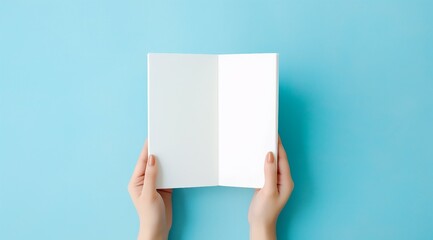 person holding a white book