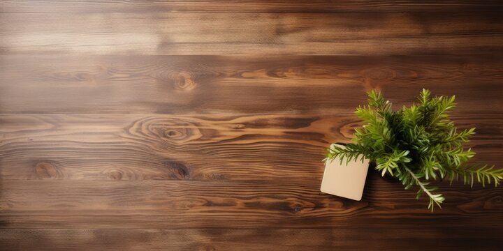 Top view of a desk with a natural wooden texture.