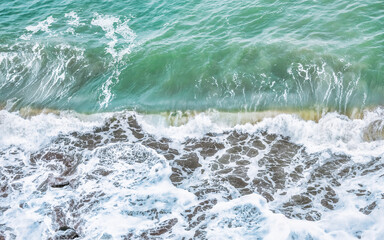Wave splashing close-up. Crystal clear sea water, in the ocean in San Francisco Bay, blue water, pastel colors.