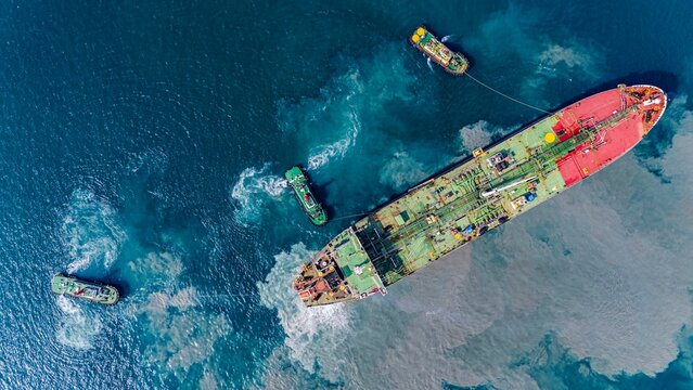 Aerial top view Oil ship tanker carier oil from refinery on the sea.