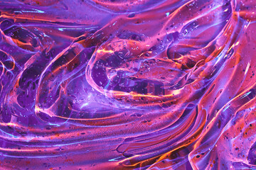 Abstract holographic neon purple, magenta pink, orange cosmetic gel serum background texture. Jelly pattern, transparent slime or liquid art gel galaxy substance. Cosmic surreal psychedelic backdrop