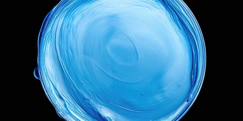 A close up view of a blue glass object on a black background. Perfect for adding a pop of color to any design