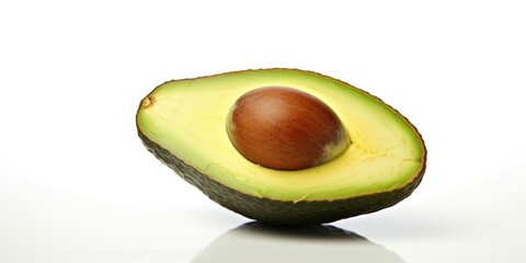 Avocado cut in half on a white surface. Perfect for healthy eating and food preparation concepts