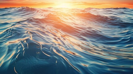 Obraz premium A beautiful sunset as the sun sets over the ocean waves. This image can be used to depict tranquility and the beauty of nature