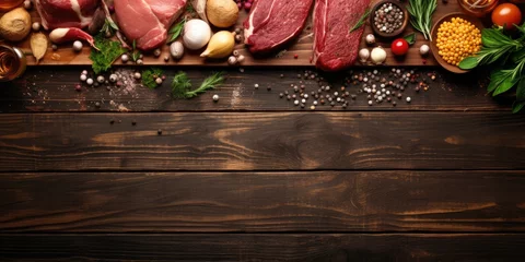 Fotobehang Assorted meats and cooking ingredients on wooden table, top view. © Vusal