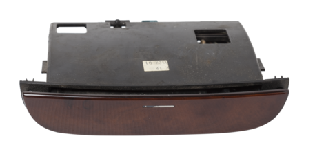 An ashtray from panel of car interior separately on a white isolated background with wooden decorative overlay.