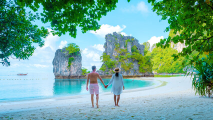 Koh Hong Island Krabi Thailand, a couple of men and women on the beach of Koh Hong during a...