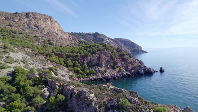 Seaside cliffs and medieval towers. Aerial view. Mediterranean Sea. Spain.