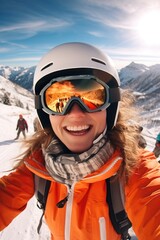 Fototapeta na wymiar A woman wearing an orange jacket and goggles taking a selfie. Perfect for capturing fun and adventurous moments. Ideal for social media posts and travel blogs