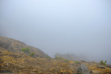 portrait of a mountain crater and accompanied by thick fog 