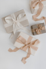 Christmas, New Year composition. Handmade winter holidays gift boxes with bows and ribbons. Festive...