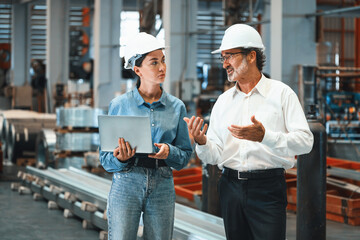 Factory manager or executive make visit metalwork manufacturing factory tour and inspect heavy...