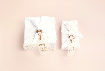 Christmas gift wrapped by traditional Japanese furoshiki style. Handmade gift package for Christmas.