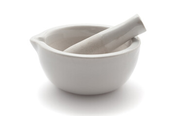 Close-up of white Ceramic Mortar and Pestle over a white background.   - obrazy, fototapety, plakaty