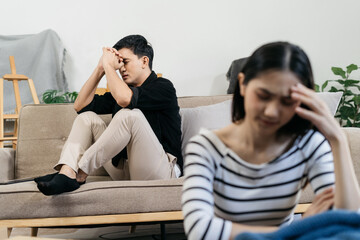 Unhappy young couple, having problems in relationship, thinking of breaking up or divorce, upset.