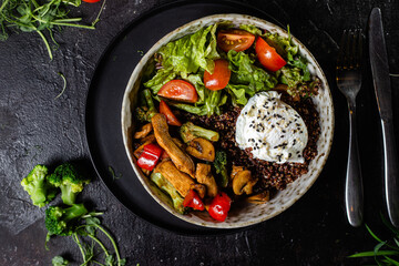 Breakfast in a plate. Poached egg with avocado and lettuce. 