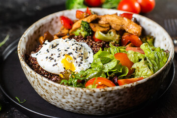 Breakfast in a plate. Poached egg with avocado and lettuce. 