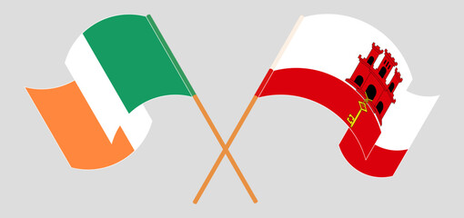 Crossed and waving flags of Ireland and Gibraltar