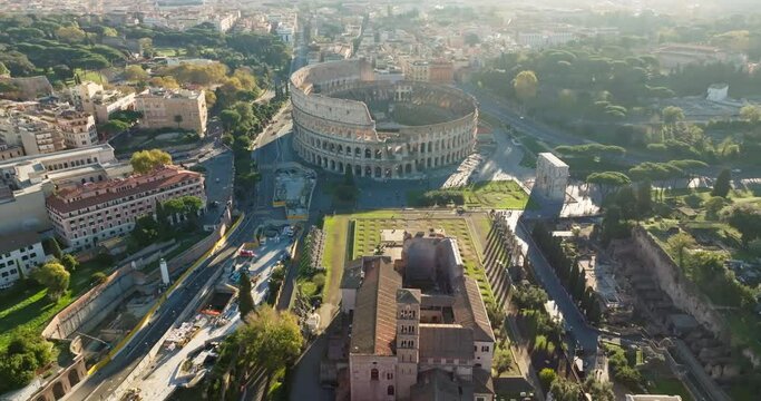 Aerial view of the Temple Palatin and the Coliseum, Rome, Italy. A tourist and historical monument, with an amphitheater and ancient ruins in the cityscape. High quality 4k footage