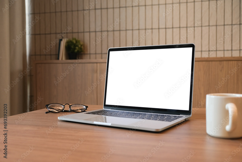 Poster Glasses, notebook and laptop on wooden office desk