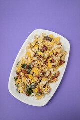 cod fish with corn bread, spinach and beans on dish