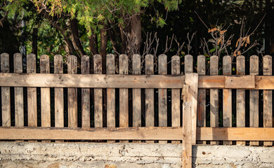 Old gray wooden fence wall of a house
