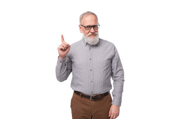 modern smart gray-haired mature businessman with a beard and mustache in a shirt and trousers on a white background