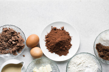 mise en place for making chocolate muffins, Flatlay of ingredients for making chocolate muffins,...