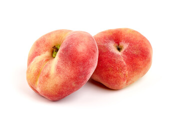 Flat Peaches, ripe nectarines, isolated on white background.