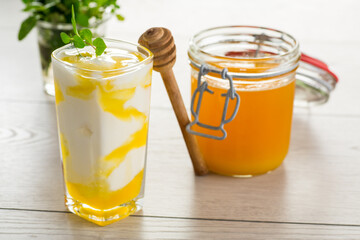 prepared homemade yogurt with natural honey in a glass